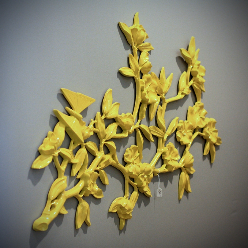yellow floral wall hanging
